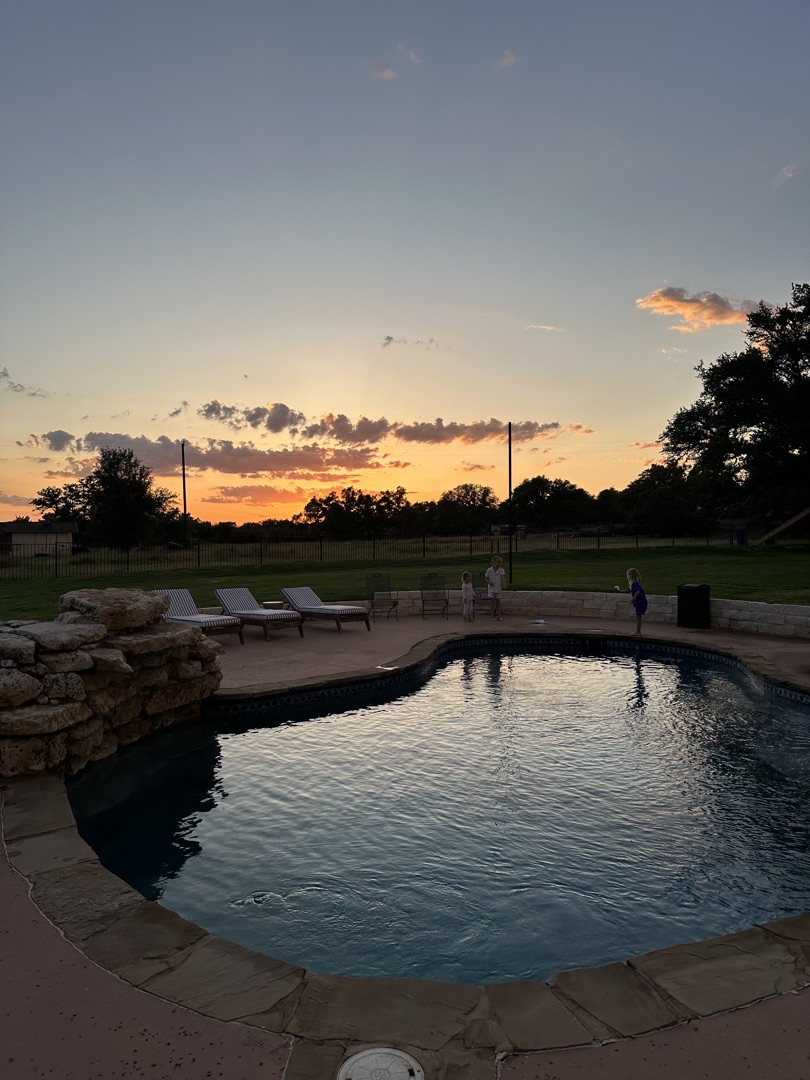Hill Country pool at sunset in Caliterra, Dripping Springs